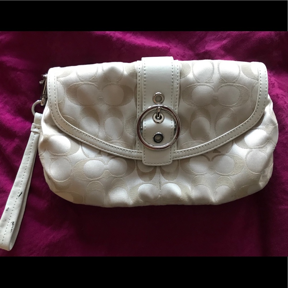 Never-used, authentic Coach clutch
